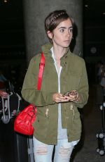 LILY COLLINS Arrives at LAX Airport in Los Angeles 08/12/2015