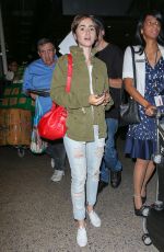 LILY COLLINS Arrives at LAX Airport in Los Angeles 08/12/2015
