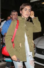 LILY COLLINS Arrives at LAX Airport in Los Angeles 08/12/2015