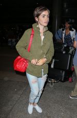 LILY COLLINS Arrives at LAX Airport in Los Angeles 08/12/2015