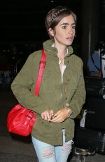 LILY COLLINS Arrives at LAX Airport in Los Angeles 08/12/2015