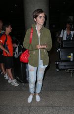 LILY COLLINS Arrives at LAX Airport in Los Angeles 08/12/2015