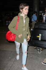 LILY COLLINS Arrives at LAX Airport in Los Angeles 08/12/2015