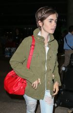 LILY COLLINS Arrives at LAX Airport in Los Angeles 08/12/2015