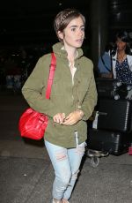 LILY COLLINS Arrives at LAX Airport in Los Angeles 08/12/2015