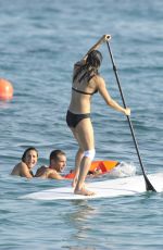 MICHELLE RODRIGUEZ in Bikini Paddleboarding in Sardinia 08/04/2015 (lq tag)