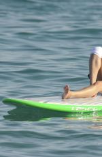 MICHELLE RODRIGUEZ in Bikini Paddleboarding in Sardinia 08/04/2015 (lq tag)