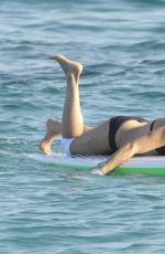 MICHELLE RODRIGUEZ in Bikini Paddleboarding in Sardinia 08/04/2015 (lq tag)