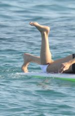 MICHELLE RODRIGUEZ in Bikini Paddleboarding in Sardinia 08/04/2015 (lq tag)