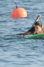 MICHELLE RODRIGUEZ in Bikini Paddleboarding in Sardinia 08/04/2015 (lq tag)
