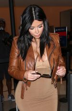 Pregnant KIM KARDASHIAN at LAX Airport in Los Angeles 08/03/2015
