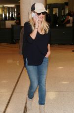 REESE WITHERSPOON in Jeans Arrives at Los Angeles International Airport 08/26/2015