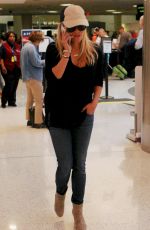 REESE WITHERSPOON in Jeans Arrives at Los Angeles International Airport 08/26/2015