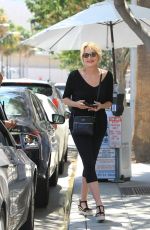 SHARON STONE Picking Up Her Car at Valet Parking