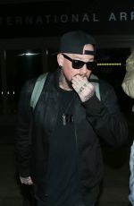 CAMERON DIAZ and Benji Madden at LAX Airport in Los Angeles