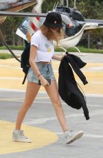 CARA DELEVINGNE at a Heliport in Rio De Janeiro 09/26/2015