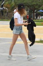 CARA DELEVINGNE at a Heliport in Rio De Janeiro 09/26/2015