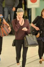 CHARLIZE THERON at LAX Airport in Los Angeles 09/29/2015