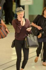 CHARLIZE THERON at LAX Airport in Los Angeles 09/29/2015