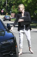 CHARLIZE THERON Leaves a Friend