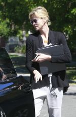 CHARLIZE THERON Leaves a Friend