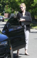 CHARLIZE THERON Leaves a Friend