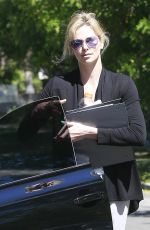 CHARLIZE THERON Leaves a Friend