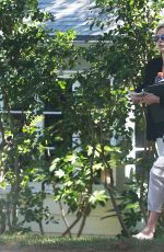 CHARLIZE THERON Leaves a Friend