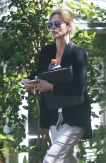 CHARLIZE THERON Leaves a Friend