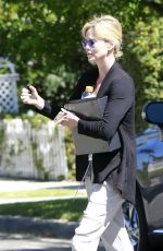 CHARLIZE THERON Leaves a Friend
