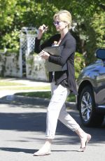 CHARLIZE THERON Leaves a Friend