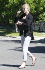 CHARLIZE THERON Leaves a Friend