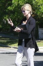 CHARLIZE THERON Leaves a Friend