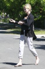 CHARLIZE THERON Leaves a Friend
