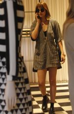 DAKOTA JOHNSON Out Shopping in Milan 09/25/2015