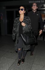 DEMI LOVATO Arrives at Heathrow Airport in London 09/07/2015
