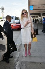 ELLE FANNING Arrives at Los Angeles International Airport 09/02/2015