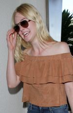 ELLE FANNING at LAX Airport in Los Angeles 08/31/2015