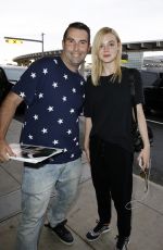 ELLE FANNING at Toronto International Airport 09/13/2015