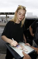 ELLE FANNING at Toronto International Airport 09/13/2015