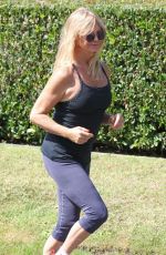 GOLDIE HAWN in Tights Out for a Walk in Brentwood