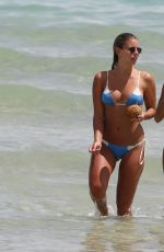 DEVIN BRUGMAN and NATASHA OAKLEY in Bikinis at a Beach in Miami 09/10/2015