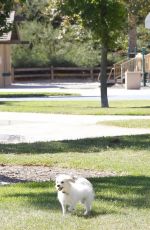 KALEY CUOCO Walks Her Dog Out at a Park in Los Angeles 09/27/2015