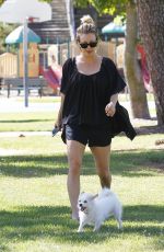 KALEY CUOCO Walks Her Dog Out at a Park in Los Angeles 09/27/2015