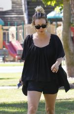 KALEY CUOCO Walks Her Dog Out at a Park in Los Angeles 09/27/2015