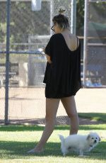 KALEY CUOCO Walks Her Dog Out at a Park in Los Angeles 09/27/2015