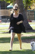 KALEY CUOCO Walks Her Dog Out at a Park in Los Angeles 09/27/2015