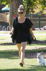 KALEY CUOCO Walks Her Dog Out at a Park in Los Angeles 09/27/2015
