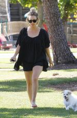 KALEY CUOCO Walks Her Dog Out at a Park in Los Angeles 09/27/2015