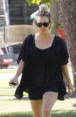KALEY CUOCO Walks Her Dog Out at a Park in Los Angeles 09/27/2015